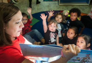 A Save the Children program coordinator leads story time after school in Washington state.