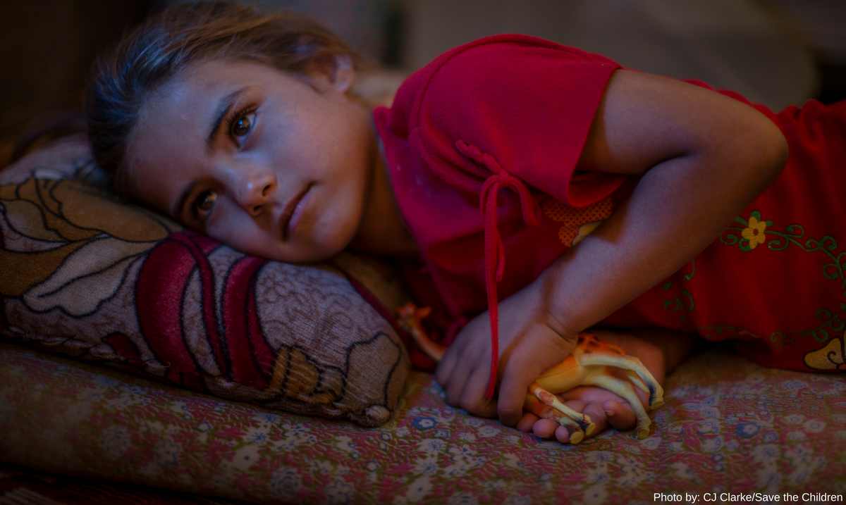 Arwa resting in her family's tent in the Khanaqin refugee camp.