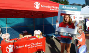 Advocate Mercedes spreads the word about investing in kids at a tabling in Iowa.